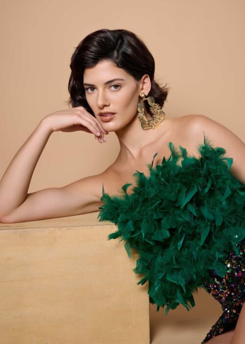 Juli Diaz in Bold Fashion: Emerald Boa Meets Sparkling Sequins